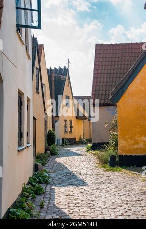 Beautiful, small, yellow rustic houses. Traditional Scandinavian style. Stock Photo