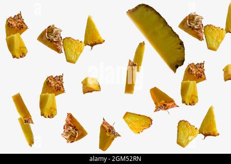 Flying pineapple slices set on white background. Falling pineapple slice isolated on white background, clipping path, full depth of field Stock Photo