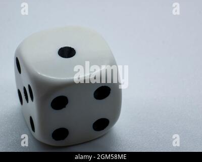 gambling white dice with number one on one side Stock Photo