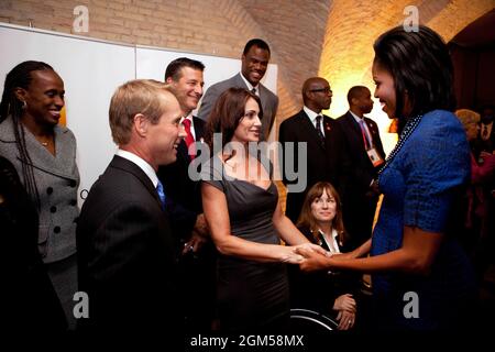First Lady Michelle Obama greets gymnast Nadia Comaneci, her husband gymnast Bart Connor, left, and other former Olympians before the Chicago 2016 Dinner in Copenhagen, Denmark, Wednesday, September 30, 2009.  From left in the background, athletes Jackie Joyner-Kersee, Bob Berland, David Robinson, and Paralympic athlete Linda Mastandrea.     (Official White House Photo by Chuck Kennedy)This official White House photograph is being made available only for publication by news organizations and/or for personal use printing by the subject(s) of the photograph. The photograph may not be manipulated Stock Photo