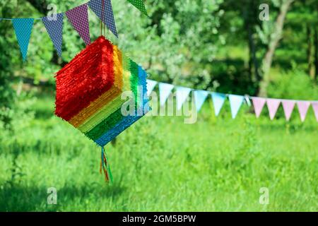 Colorful Mexican pinata hanging outdoors Stock Photo