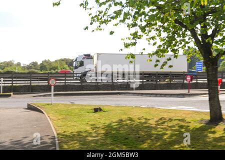 A white un-marked HGv drives on the M27 motorway near Southampton Stock Photo