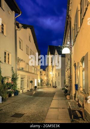 Cobblestone street and medieval architecture at night, in the Old Town ...