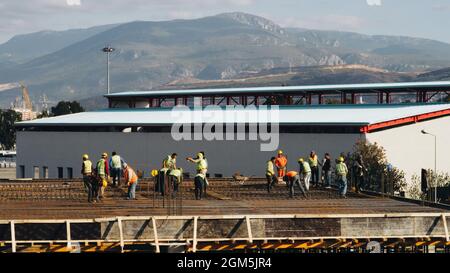 Engineers and workers working on a construction site Stock Photo