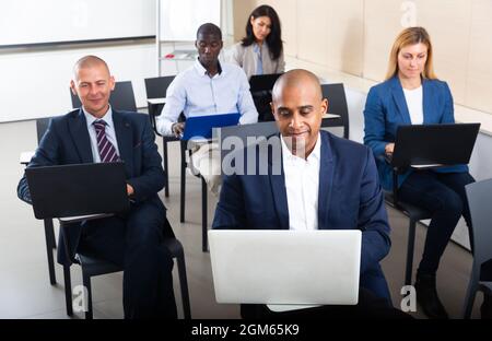 international group of managers with laptop in advanced training courses Stock Photo