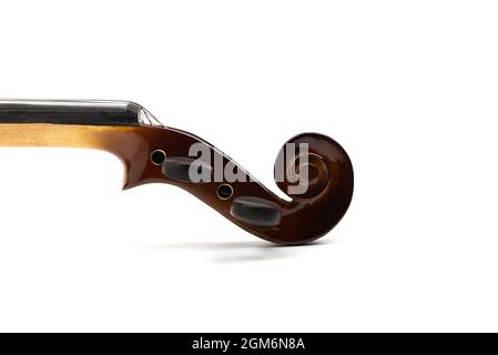 Close up peg box of violin with scroll, pegs and top nut on white background. Copy space. Stock Photo
