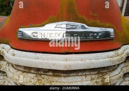 The chrome nameplate on the front of a 1951 Chevy pickup in Idaho, USA Stock Photo