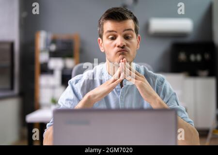 Pondering Thinking Professional Businessman In Office. Contemplative Man Stock Photo