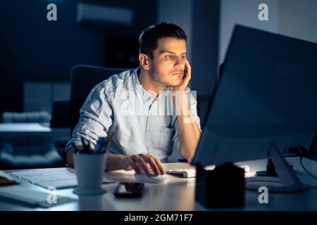 Business Analyst Businessman Working Late On Computer In Office Stock Photo