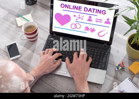 Online dating concept shown on a laptop used by a man Stock Photo