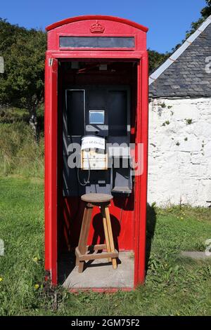 Out of order sign in a red telephone box on the Isle of Canna in the Inner Hebrides of Scotland Stock Photo