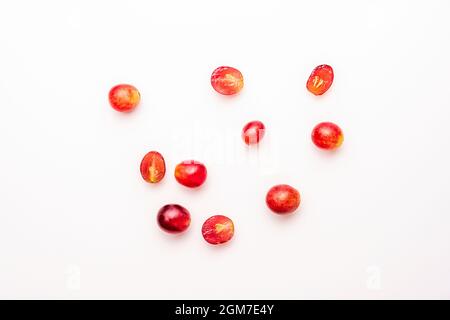 top view image of some claret red dessert grapes on white table Stock Photo