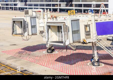 airplane Bridge in airport for passengers boarding or Jetway waiting for a plane to arrive on airport or airport terminal boarding gate. Stock Photo