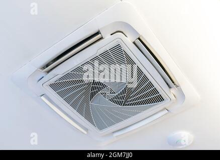 Cassette type air condition with lighting and fire protection system installation on ceiling. Stock Photo