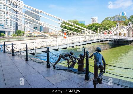 Cavenagh Bridge over the Singapore River is one of the oldest bridges and the only cable-stayed suspension bridge in Singapore. Stock Photo