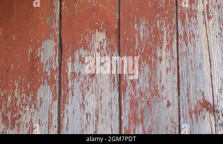 Wooden background - the red old paint peeling off Stock Photo