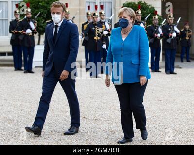 Paris, France. 17th Sep, 2021. French President Emmanuel Macron welcomes German Chancellor Angela Merkel upon her arrival at the Elysee Palace in Paris, France, Sept. 16, 2021. Credit: Xinhua/Alamy Live News
