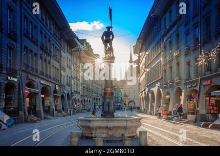 ZERMATT, SWITZERLAND - APRIL 10, 2018: Street view on Kramgasse with fountain and clock tower in the old town of Bern city.It is a popular shopping st Stock Photo