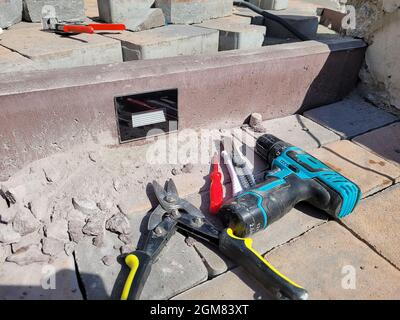 installation of the lamp in a concrete curb. Selective focus Stock Photo