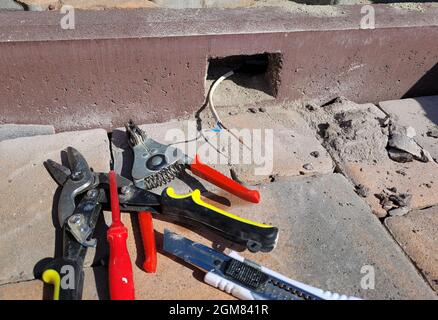 installation of the lamp in a concrete curb. Selective focus Stock Photo