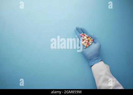 doctor holding medical pill on palm of hand  Stock Photo