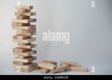 Board game jenga tower of light wood sticks Stock Photo