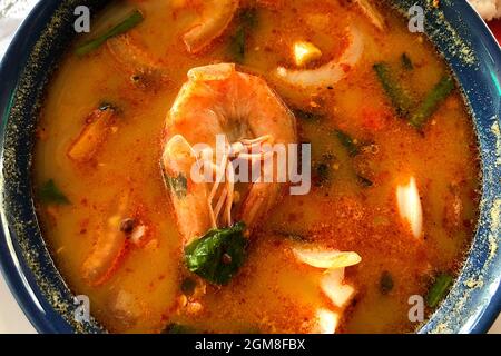 Tom Yum Goong Spicy Sour Soup top view. Thai local food. Stock Photo