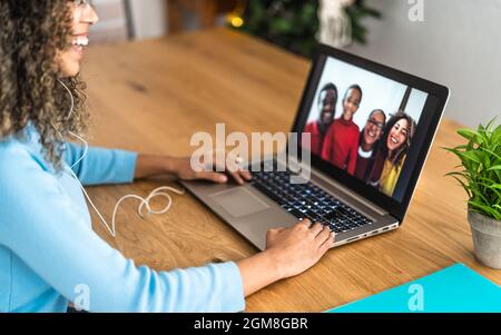 Happy African family doing video call using laptop at home - Technology and communication concept Stock Photo