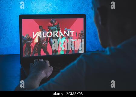 Valorant is a free-to-play first-person hero online shooter. Video computer  game. Man play video game on laptop Stock Photo - Alamy