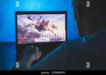Call of Duty: Warzone is a free-to-play battle royale video game. Video  computer game. Man play video game on laptop Stock Photo - Alamy
