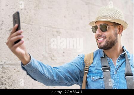 Happy tourist taking selfie in old city. High quality photo. Stock Photo