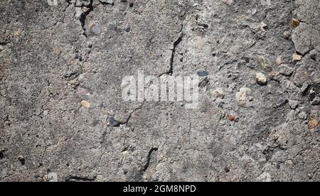 Texture of concrete. Asphalt background. Road surface. Texture of asphalt and stones on road. Stock Photo