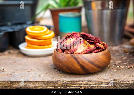 Dried strawberry fruits sliced chips on the table. Stock Photo