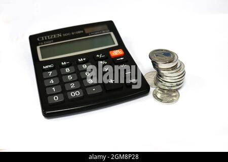 Calculator is a calculating tool that is commonly used to calculate money and simple mathematical calculations, but is more widely used by merchants i Stock Photo