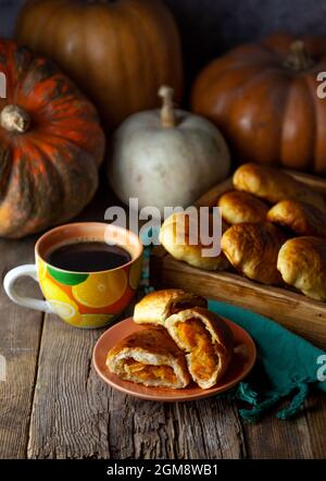 Pumpkin patties. Autumn food. You are on the table. A treat for Halloween. Still life. Sweet pastries with filling. Pie. Stock Photo
