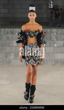 Models on the catwalk during the Edward Crutchley show at London Fashion Week September 2021 held in the Collins Music Hall in London. Picture date: Friday September 17, 2021. Stock Photo