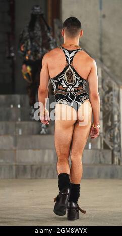 Models on the catwalk during the Edward Crutchley show at London Fashion Week September 2021 held in the Collins Music Hall in London. Picture date: Friday September 17, 2021. Stock Photo