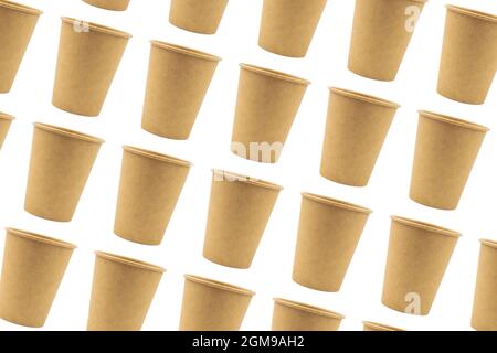 Disposable paper cups made of thick cardboard isolated and duplicated on a white background. Patern, background. Stock Photo