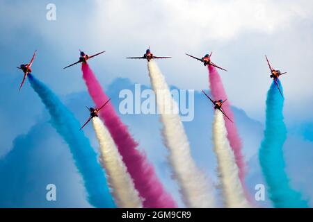 RAF Red Arrows aerobatic demonstration team performing at the Sanicole Airshow during sunset. Belgium. September 10, 2021 Stock Photo
