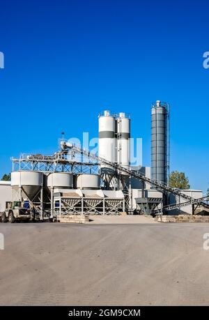 Construction industry concrete mixing batching plant and equipment. Stock Photo