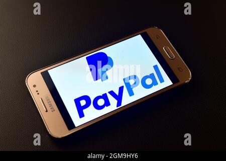 Italy - february 10, 2019:  Paypal logo on smartphone screen. Paypal is an American online payment and banking company. Stock Photo