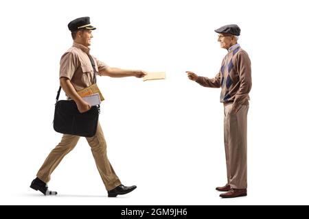 Full length profile shot of a postman delivering letter to a male pensioner isolated on white background Stock Photo