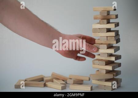 Board game jenga tower of light wood sticks Stock Photo