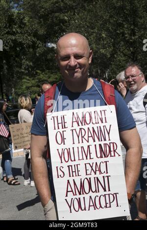 People demonstrate and march from Foley Square in Manhattan to speak out against individual rights being slowly eroded due to Covid-19. People speak out against mandatory vaccines which they say are still experimental, and say no to vaccine passports, a step towards fascism and even echoing Nazi Germany.  Medical freedom was the word of the day. Stock Photo