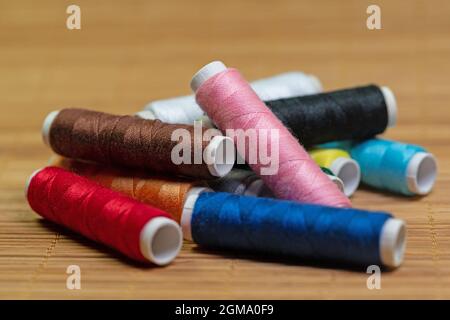 Sewing thread, spools of thread in different colors Stock Photo