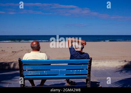 Elderly couple enjoying the sea view. Lovely homosexual relationship by the sea. hate free love. Stock Photo