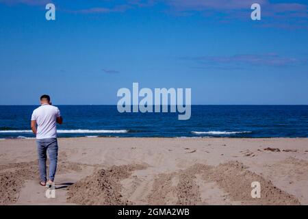 thoughtful man having a conversation with phone. Getting sad news. life is always hard for man. Stock Photo