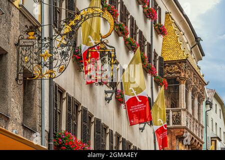 The Golden Roof (Goldenes Dachl) is the symbol of Innsbruck, a loggia covered with golden copper tiles at the end of Via Maria-Theresien-Strasse. Stock Photo