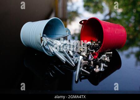 Difference between men and women shown by screws. women are more complex and various. men are simple and analog. Stock Photo