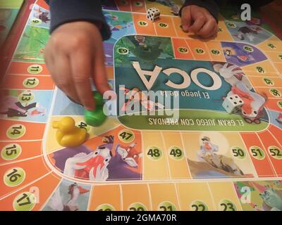 children playing a board game Stock Photo